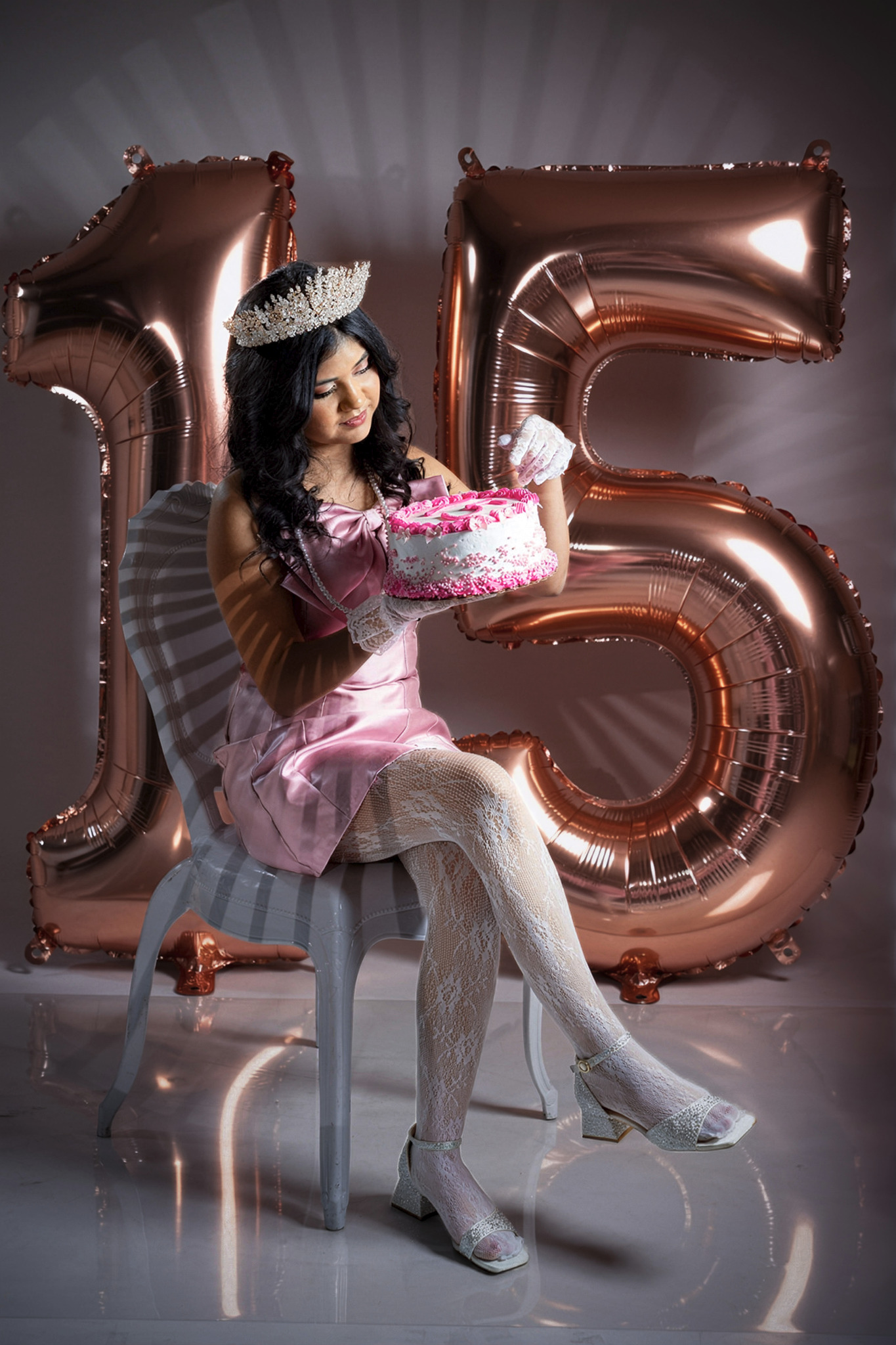 Kailah holding her Quinceañera cake